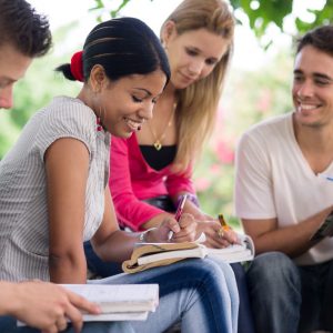Friends and education, group of university students studying, reviewing homework and preparing test
