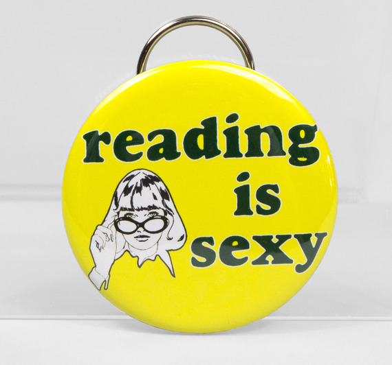 This Reading is Sexy bottle opener is yellow with black letters