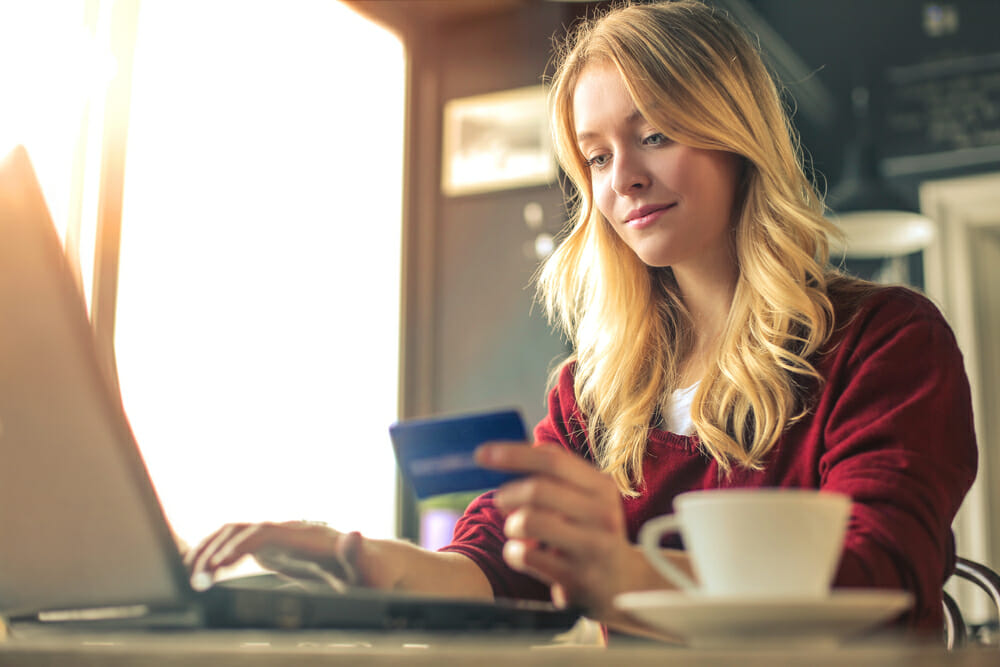 Woman shopping online with credit card