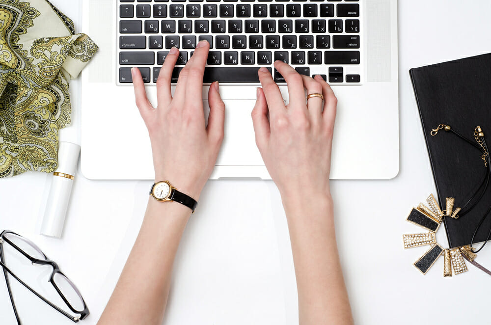 Hands typing on a keyboard