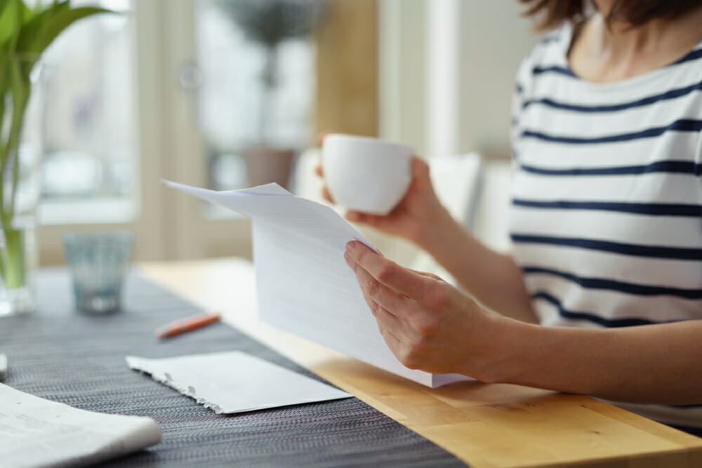 woman looking at a piece of paper