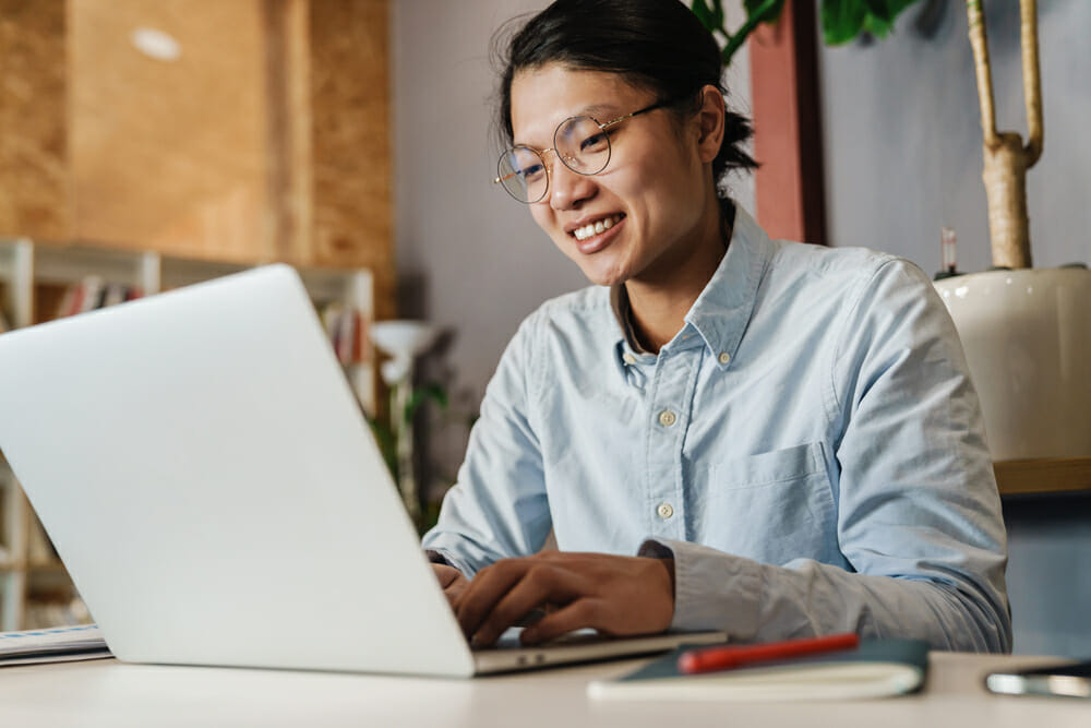 Man on a laptop at a table