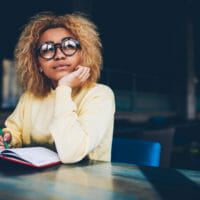 Woman writing in a notebook