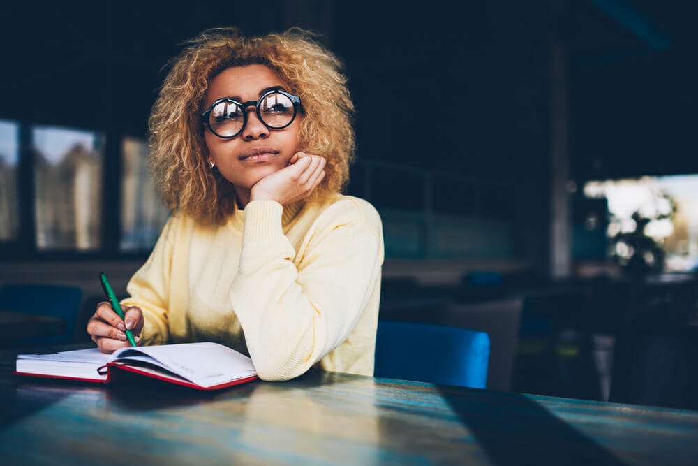 Woman writing in a notebook