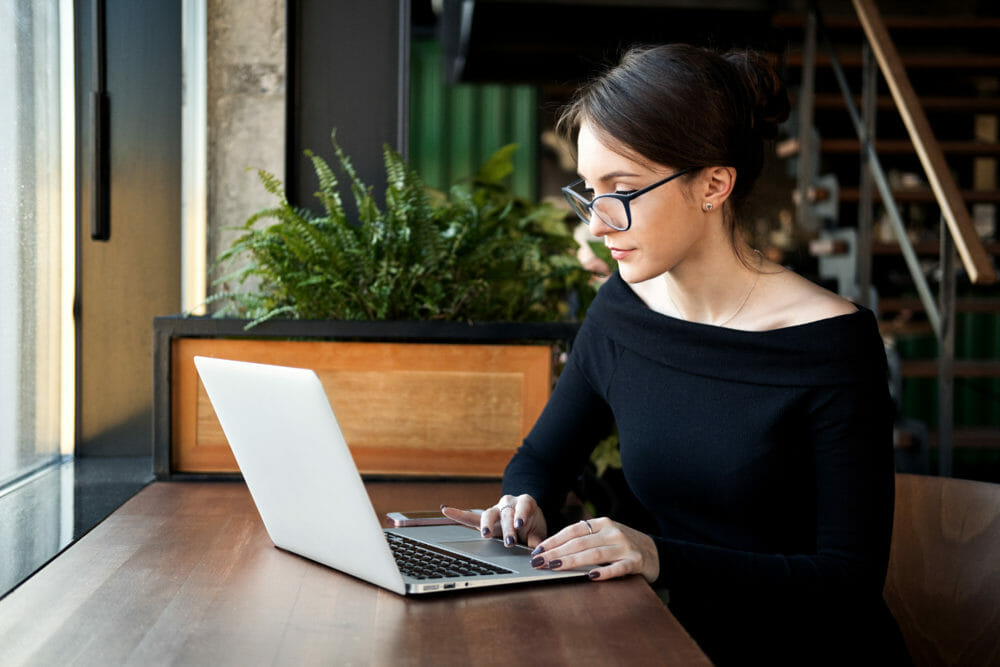 Woman sitting at a desk on her laptop