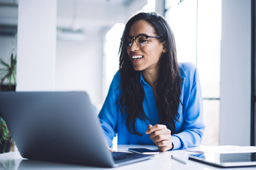 Woman sitting in front of her laptop