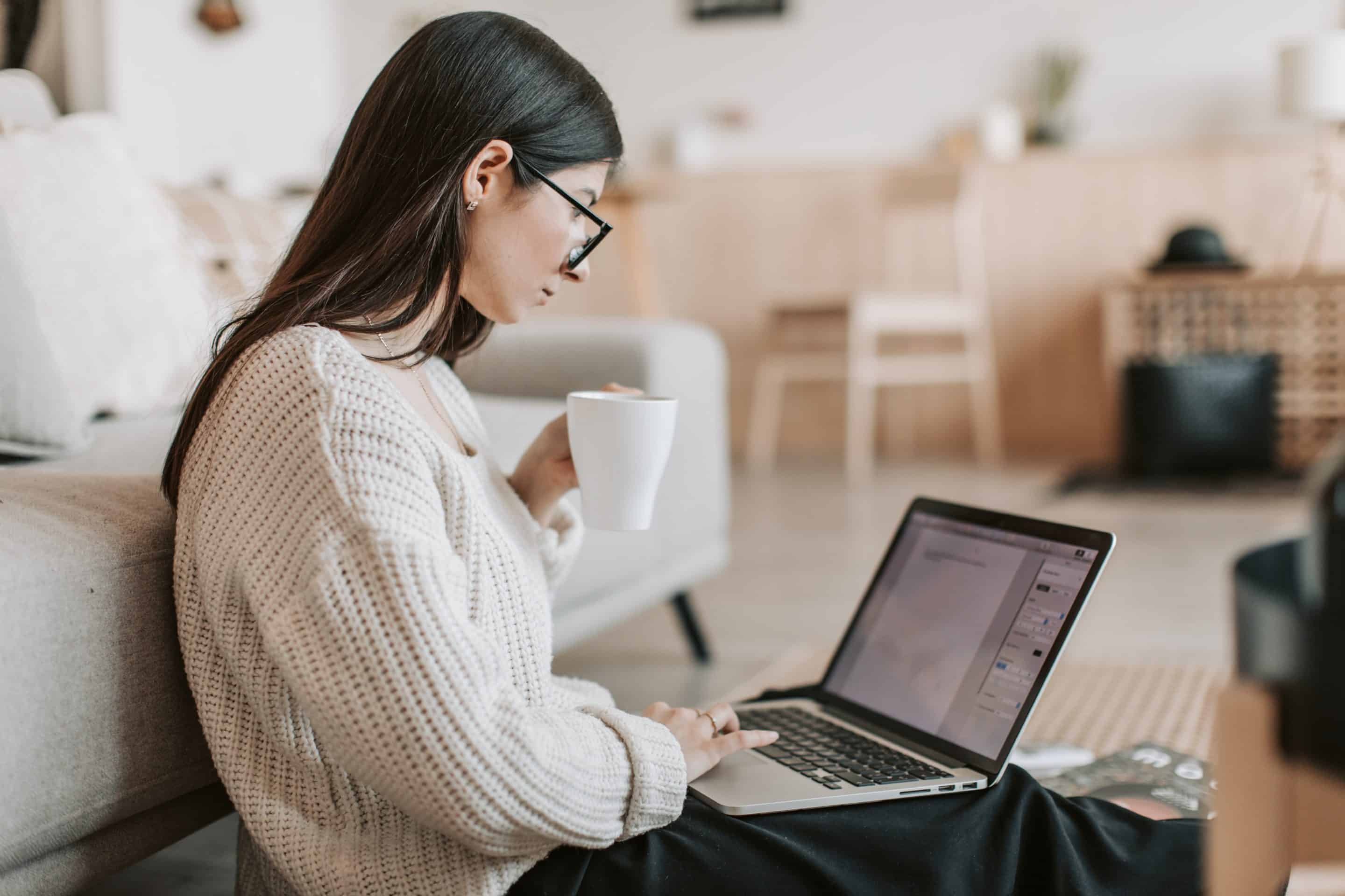 Woman sitting and typing on her laptop.